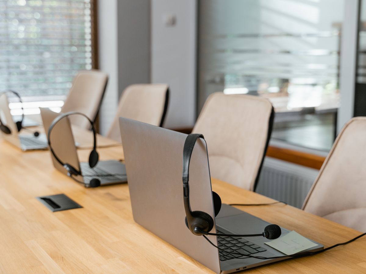 Headsets set up at office workstations