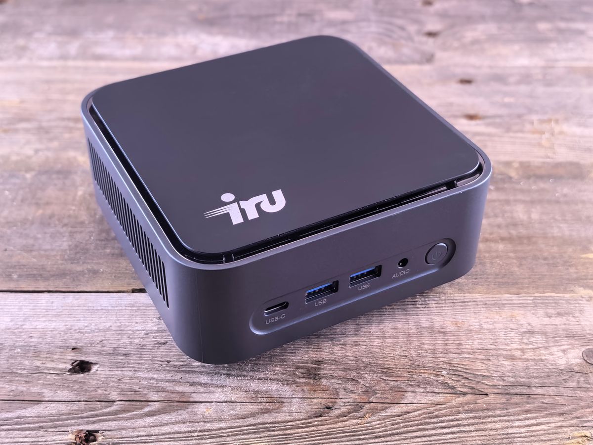 Compact mini PC with USB-C ports on a desk