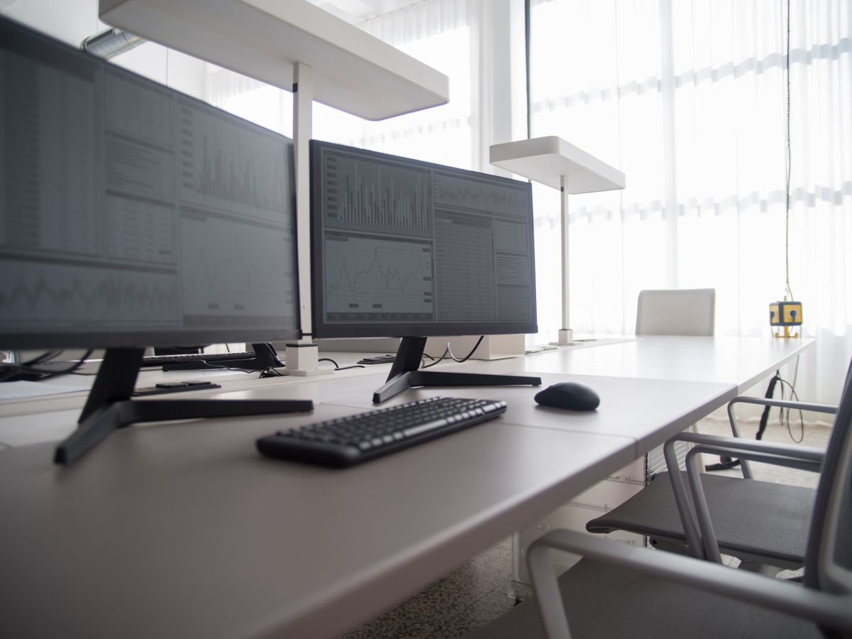 Office fitted out with monitors at multiple desks