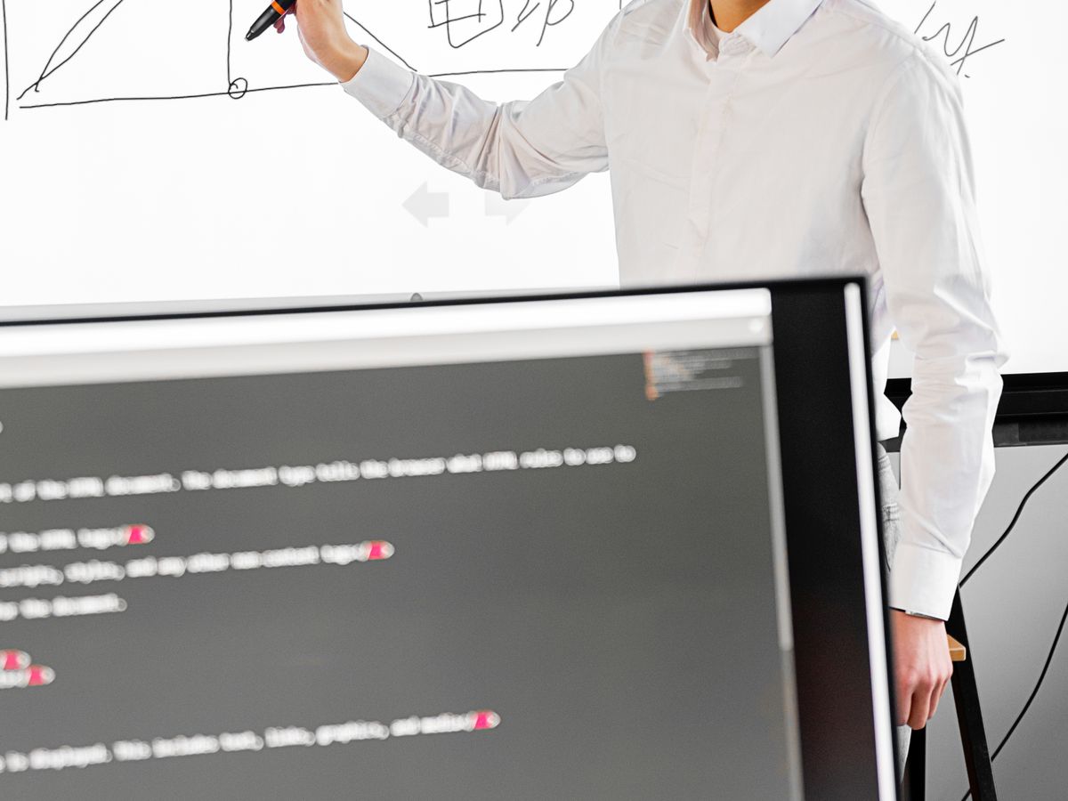 Presenter using an interactive touch display in a training room