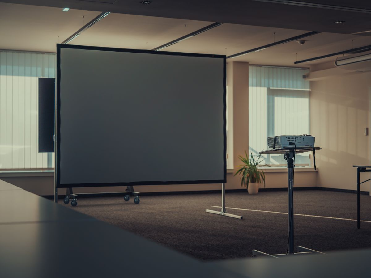 Projector and presentation screen in a meeting room