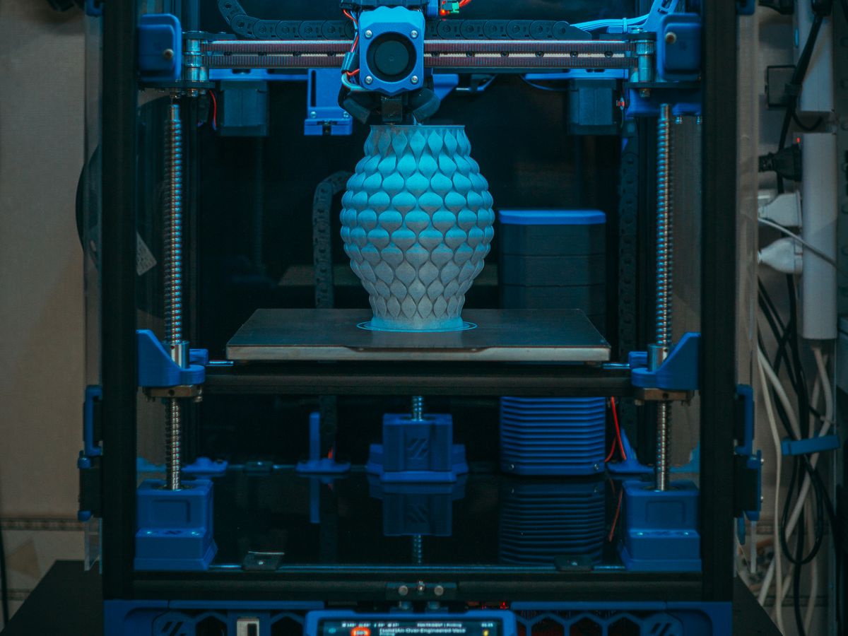 3D printer building an object layer by layer
