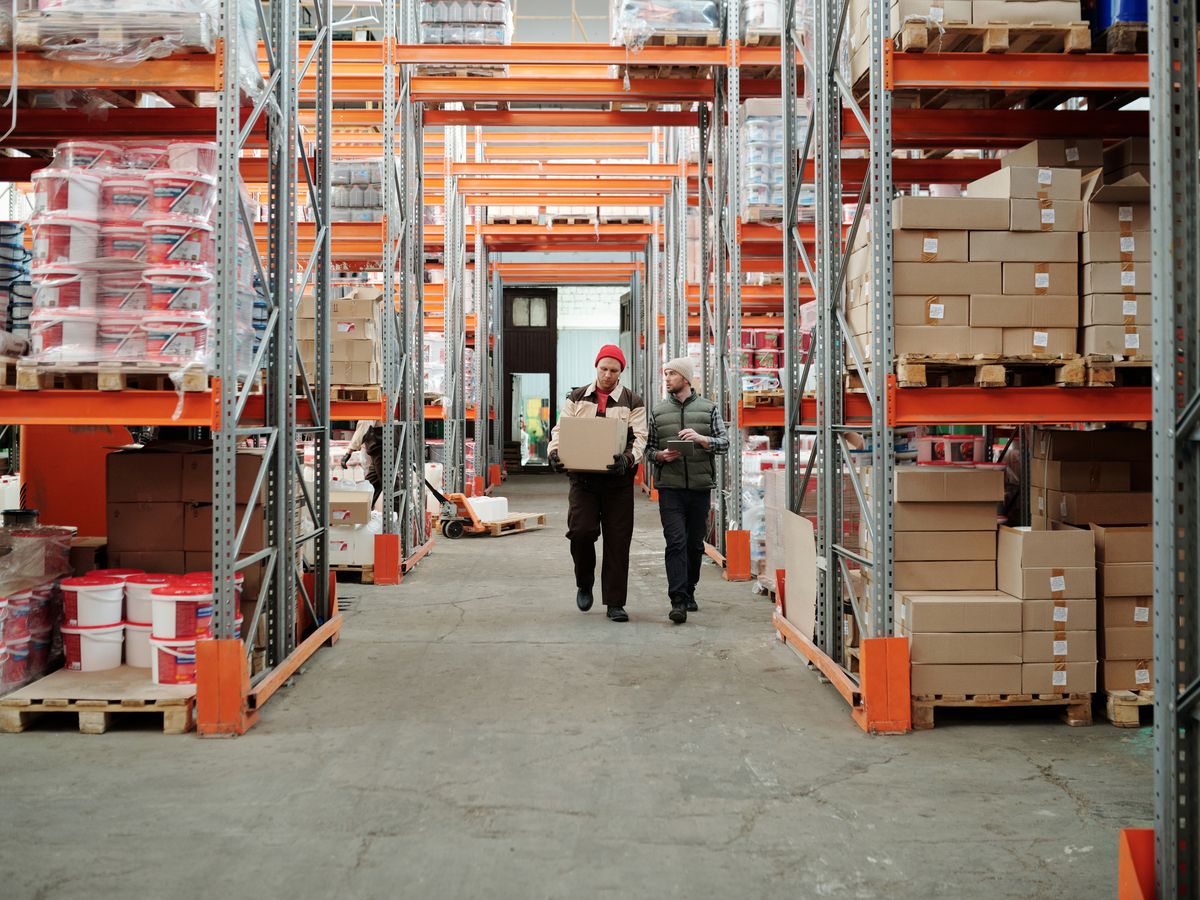 Warehouse staff handling stock from the shelves