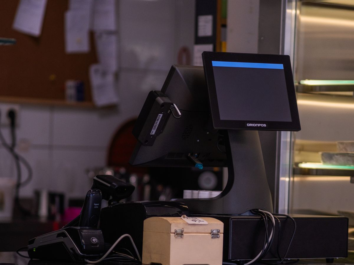 Complete point-of-sale system set up on a cafe counter