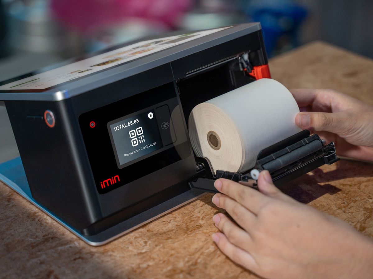 Loading a thermal paper roll into a point-of-sale device
