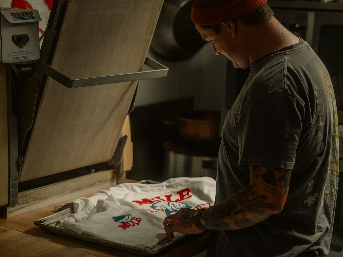 Heat press printing a design onto a garment