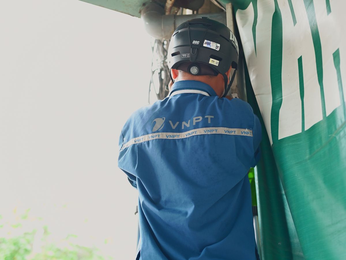 Technician installing security equipment on site