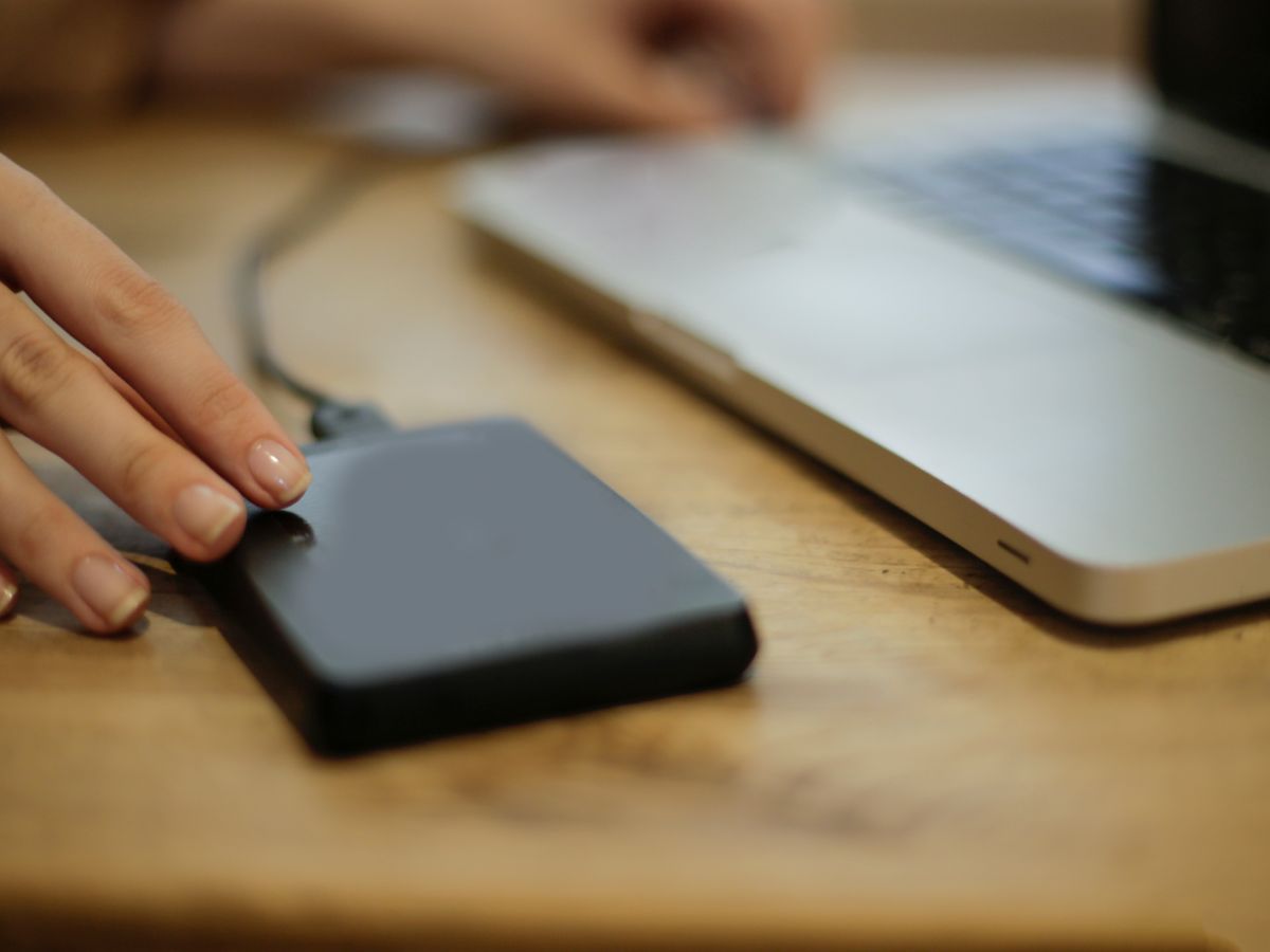 External hard drive connected to a laptop for backup